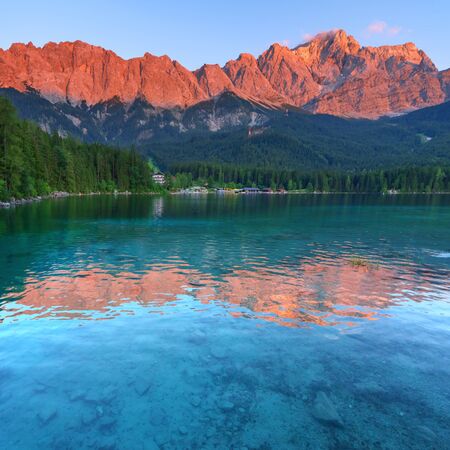 Fantastic sundown on mountain lake Eibsee, located in the Bavaria, Germany. Dramatic unusual scene. Alps, Europe.の写真素材