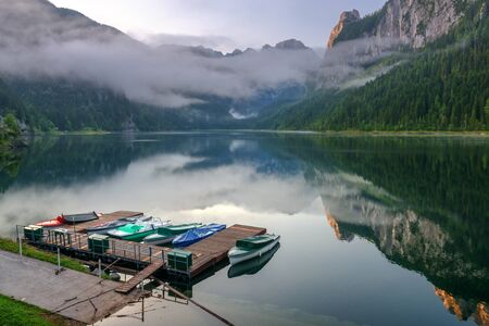 Fantastic morning on mountain lake Gosausee, located in the Austia. Dramatic unusual scene. Alps,...