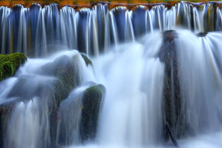waterfall cascades and stone closeup
