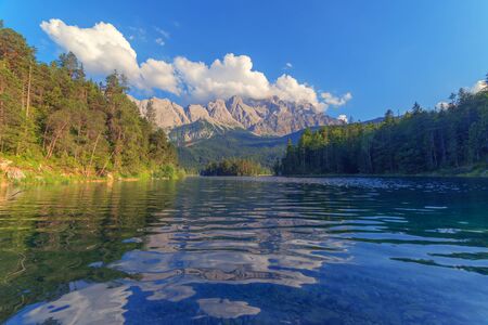 Fantastic day on mountain lake Eibsee, located in the Bavaria, Germany. Dramatic unusual scene....