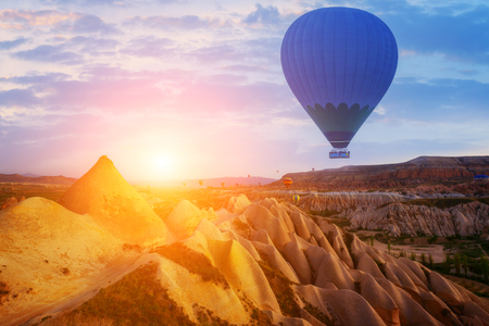 Balloon silhouette in the sunrise sky. Cappadocia, Turkeyの写真素材