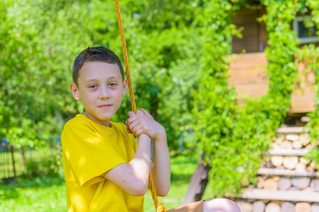 Smiling boy on treehouse. Summer time!の写真素材