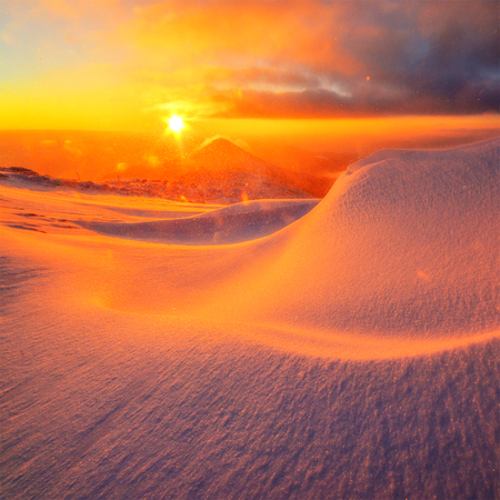 Fantastic orange evening landscape glowing by sunlight. Dramatic wintry scene with. Carpathians, Ukraineの写真素材