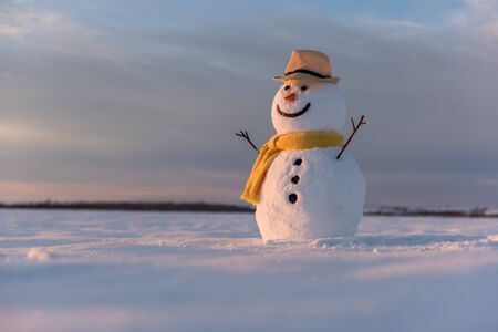 snowman on orange sunset backgroundの写真素材
