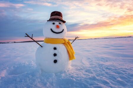 snowman on orange sunset backgroundの写真素材