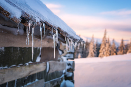 Fantastic landscape with snowy house. Carpathians, Ukraine, Europe.の写真素材
