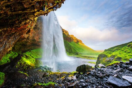 Sunrise on Seljalandfoss waterfall on Seljalandsa river, Iceland, Europe.