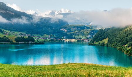 Amazing view of the Lungerersee lake in the morning mist. Lungern village, Switzerland, Europe.の写真素材