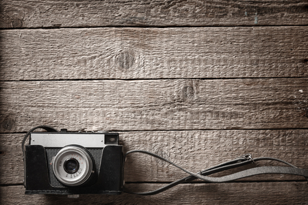 photography background with old camera and wooden tableの写真素材