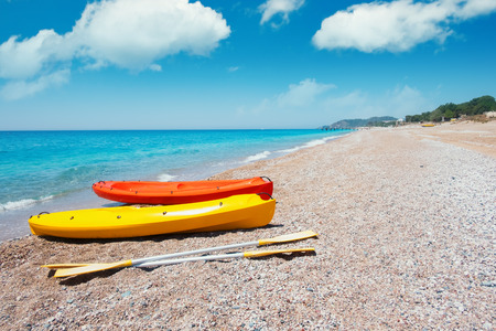 Two kayaks on sea edge. Sunny day on mediterranean sea. Summer timeの写真素材