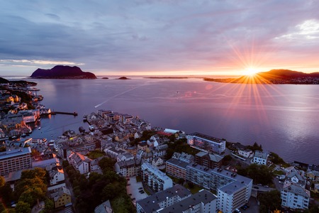 Colorful sunset in Alesund port townの写真素材