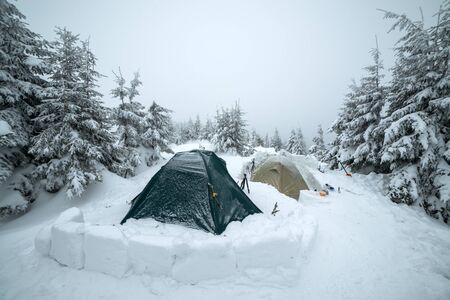 Frozen tents in the high mountainの写真素材