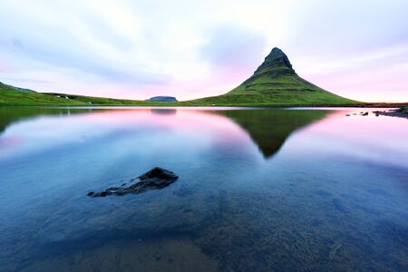 Colorful sunrise on Kirkjufellsfoss waterfallの写真素材