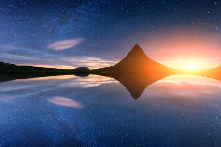 Starry sky on Kirkjufellsfoss waterfall.の写真素材