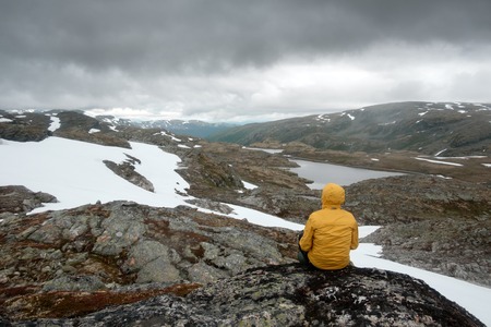 Typical norwegian landscape with snowy mountainsの写真素材