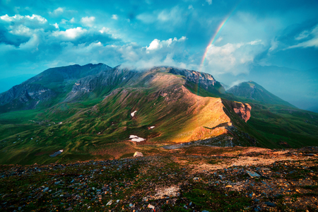 Amazing rainbow on the top of Grossglockner pass, Alps, Switzerland, Europe. Landscape photographyの写真素材
