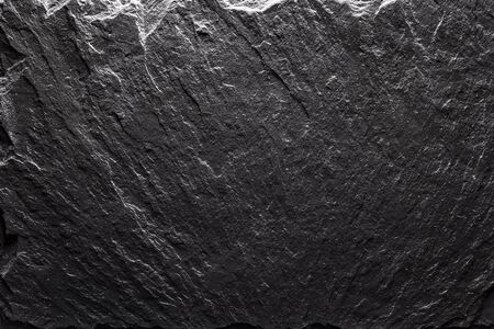 Black slate texture closeup. Can be used like food backgroundの写真素材