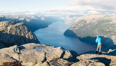 Photographer taking photo of Lysefjorden fjord near Preikestolen (pulpit-rock) - famous tourist attraction in the municipality of Forsand in Rogaland county, Norway.の写真素材