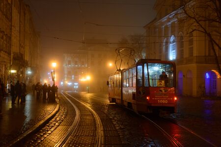 Lviv, Ukraine - Fabruary 11, 2015: Tram on Market square in winter timeのeditorial素材