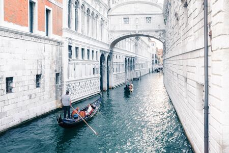 Venice, Italy - August 7, 2014: gondolas and boats on venetian canalのeditorial素材