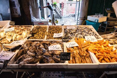 Venice, Italy - August 8, 2014: fresh seafood on venetian market with price listのeditorial素材