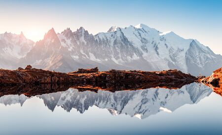 Incredible view of clear water and sky reflection on Chesery lake (Lac De Cheserys) in France Alps.の写真素材