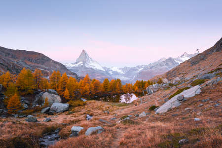 Incredible colorful sunrise on Grindjisee lake with Matterhorn Cervino peak in Swiss Alps. Zermatt resort location, Switzerland. Landscape photographyの写真素材