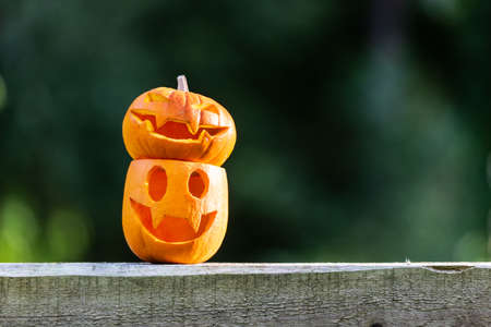 Halloween pumpkins or jack-o-lantern at home terrace. Decoration and holidays concept