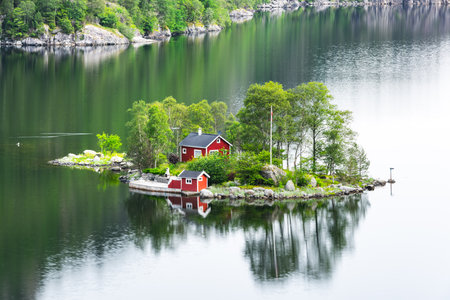 Breathtaking view of small island with red house in Lovrafjorden fjord, Norway. Landscape photographyの写真素材