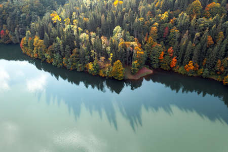 Aerial view on lake with turquoise water in Carpathian Mountains