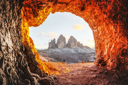 Tre Cime Di Lavaredo peaks in incredible orange sunset lightの写真素材