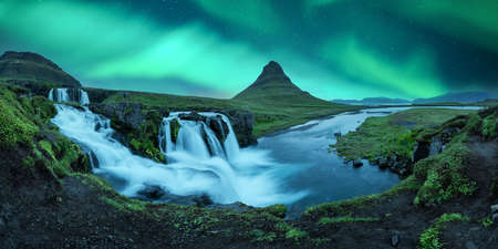 Aurora borealis Northern lights over Kirkjufellsfoss waterfallの写真素材