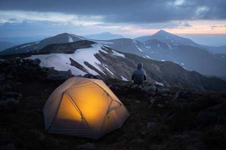 Grey tent lighted from the inside