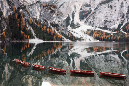 Picturesque landscape with famous lake Braies in autumn Dolomites
