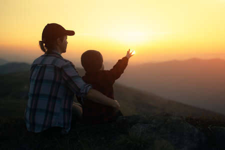 Mom with son in the autumn mountainsの写真素材