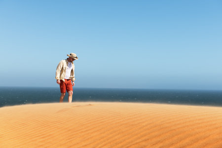 Single man in a cowboy hat in the Namib desertの写真素材