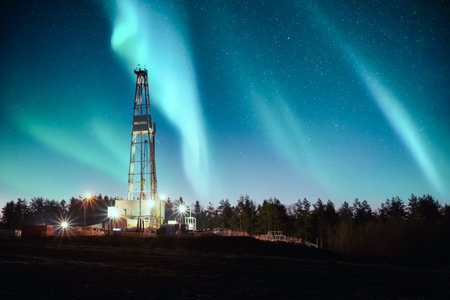 Aurora borealis Northern lights over oil gas drilling rigの写真素材