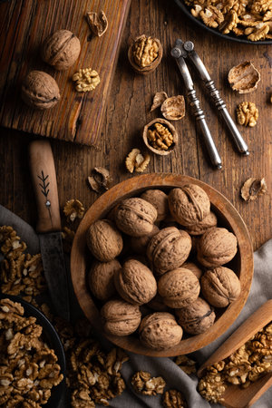Walnuts nuts open with a vintage nut crackerの写真素材