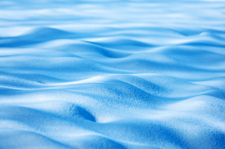 Abstract winter background from blue snowの写真素材