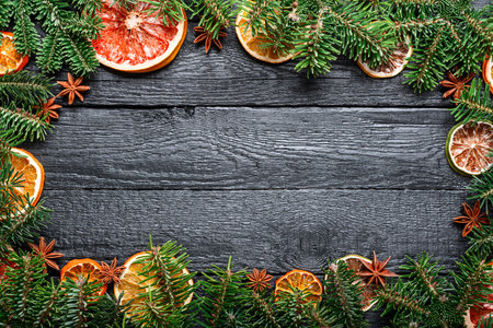 Christmas or New Year background with a border of green fir branchesの写真素材