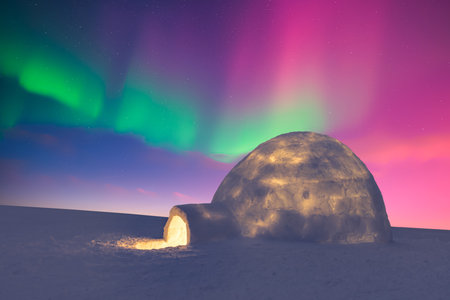 Aurora borealis. Northern lights in winter field. Wintry scene with glowing polar lights and snowy igloo. Christmas postcardの写真素材