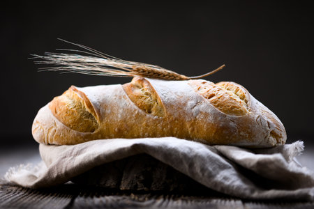 Homemade sourdough baguette bread with cracked crust