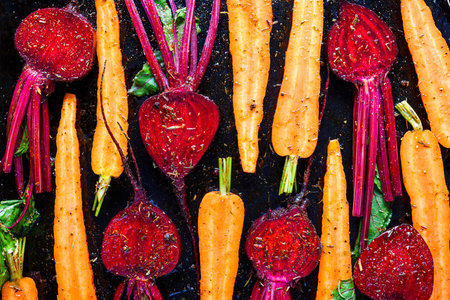 Carrots and beetroot mixed with oil and seasoningの写真素材