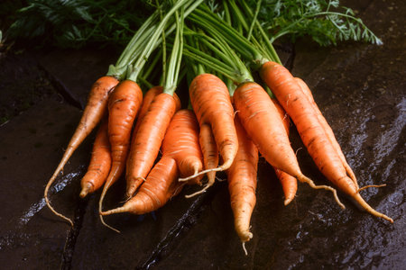Fresh carrots with soil traces