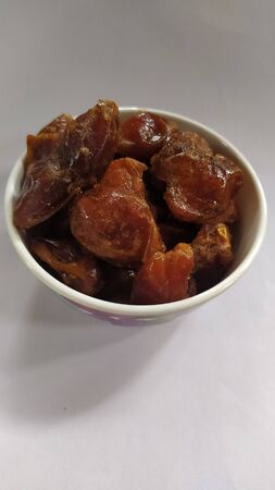 Sweetened dates in a small bowl.の写真素材