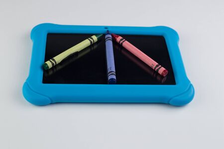 Using a tablet or electronic device for learning.