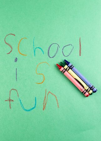 Grade school writing with crayons - Education is fun.の写真素材