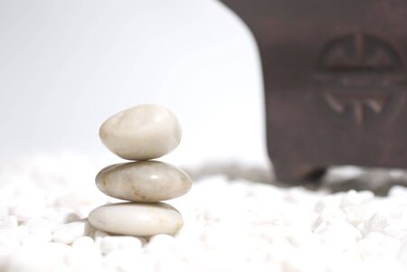 zen stones on white pebbles background - meditation conceptの写真素材