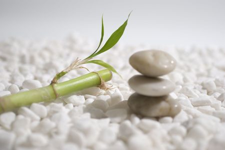 zen stones and bamboo on white pebbles background - meditation conceptの写真素材