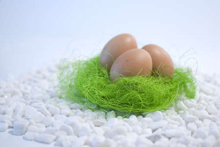Easter eggs in a green straw